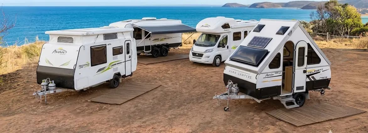 Avan caravans and campers parked near the coast